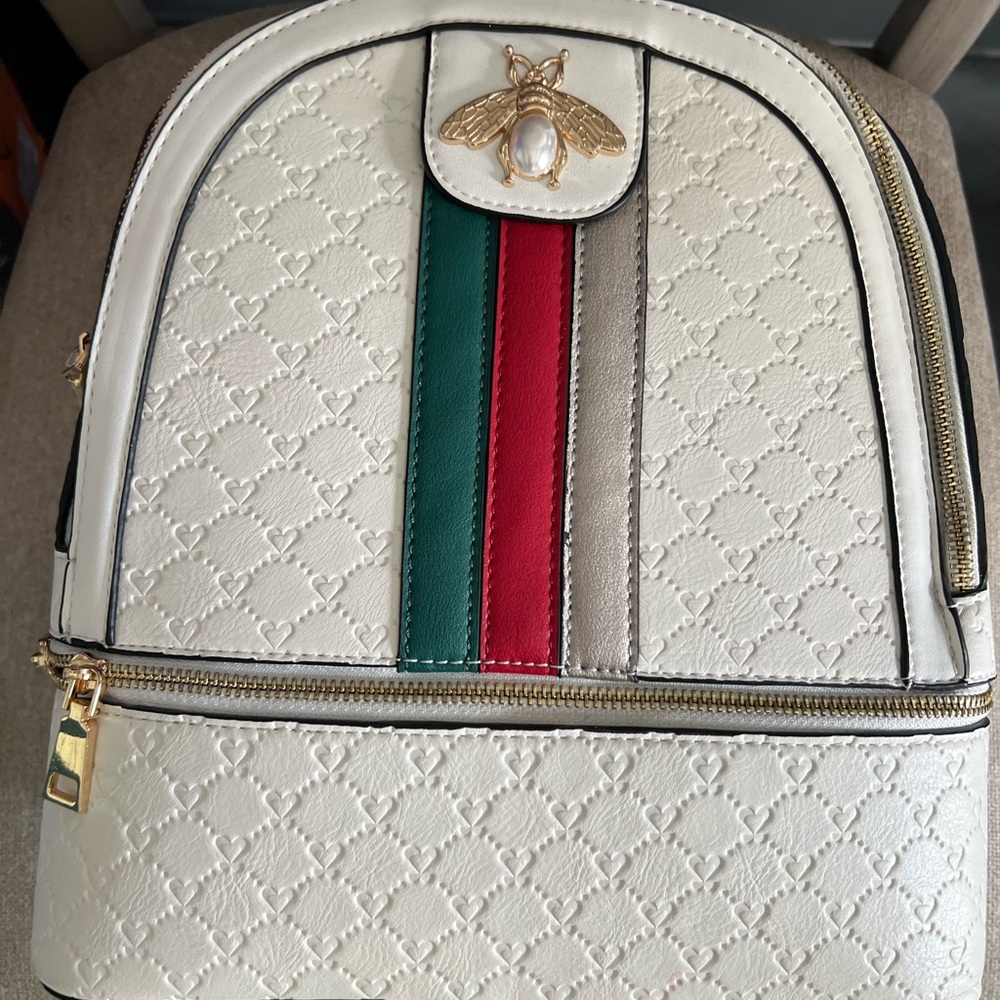 Elegant Cream Backpack with Gold Accents